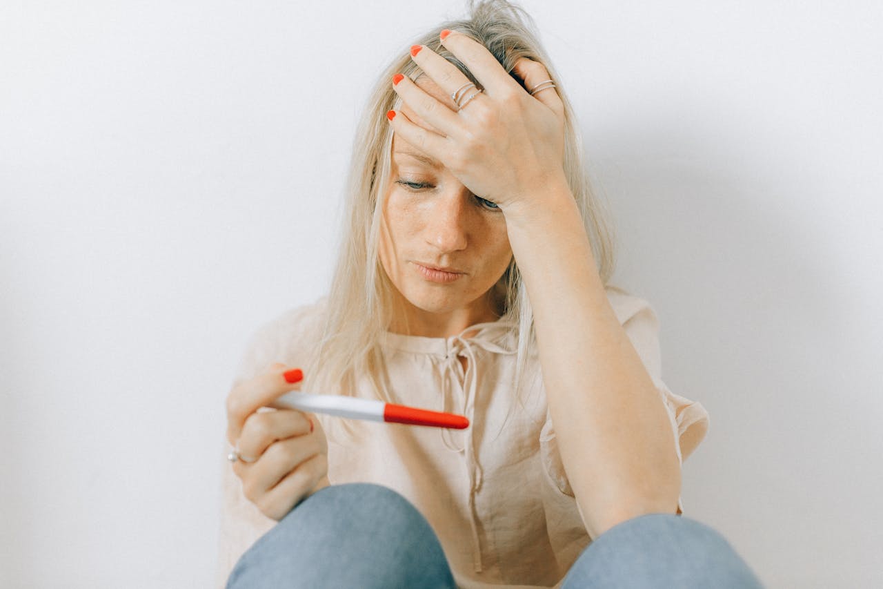 Woman looking at a pregnancy test